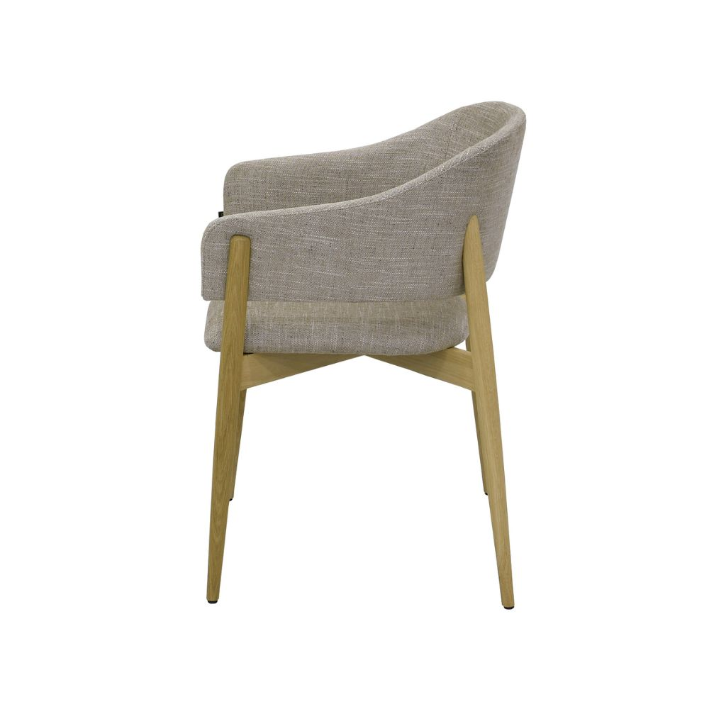 A modern upholstered dining chair with a curved backrest, light beige textured fabric, and light natural wood legs, shown from a three-quarter angle on a white background.